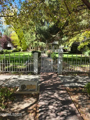 a view of a park with large trees