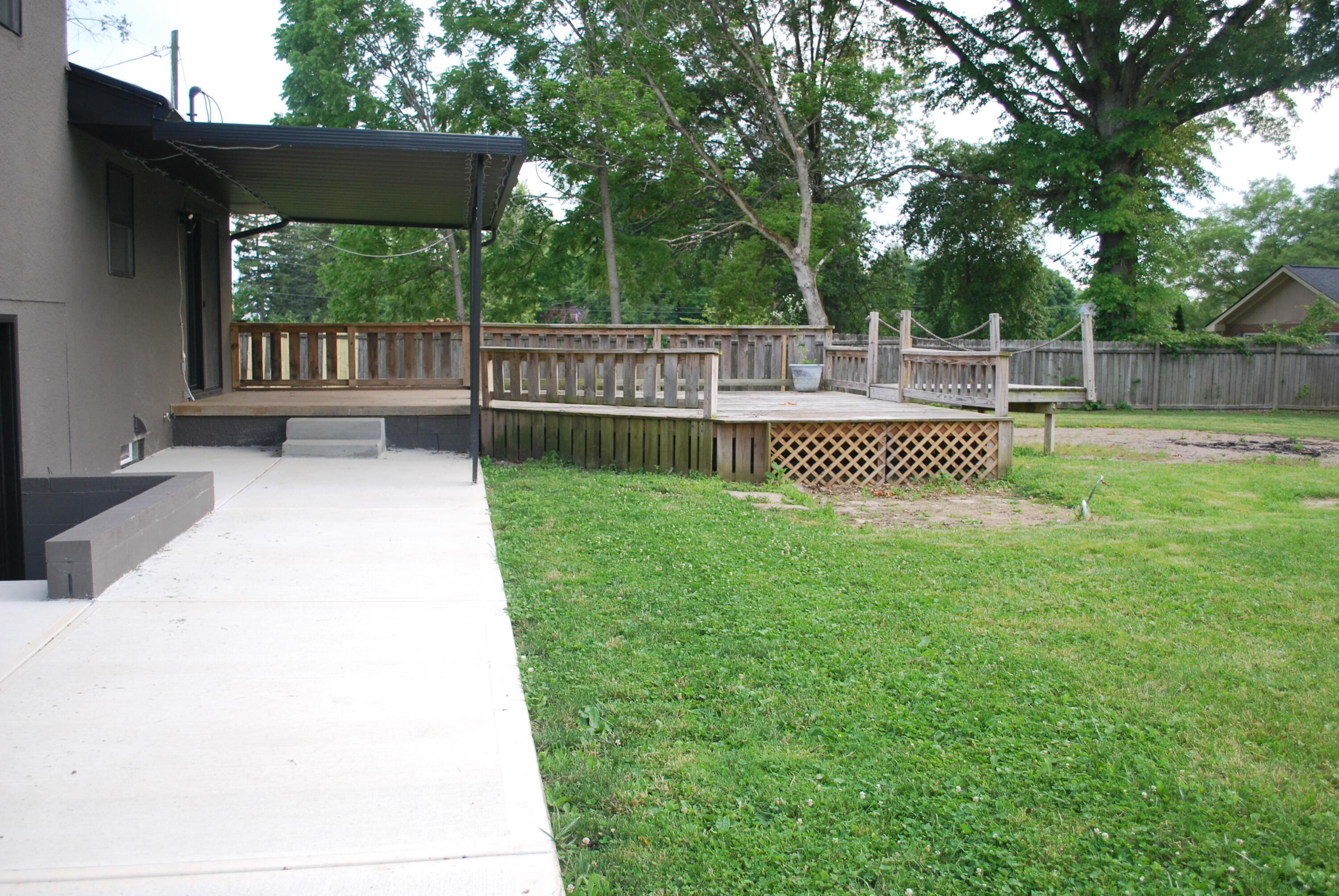 7404 Worthington Road Westerville, OH 43082 - Photo 9 of 32 wooden deck and lower level patio