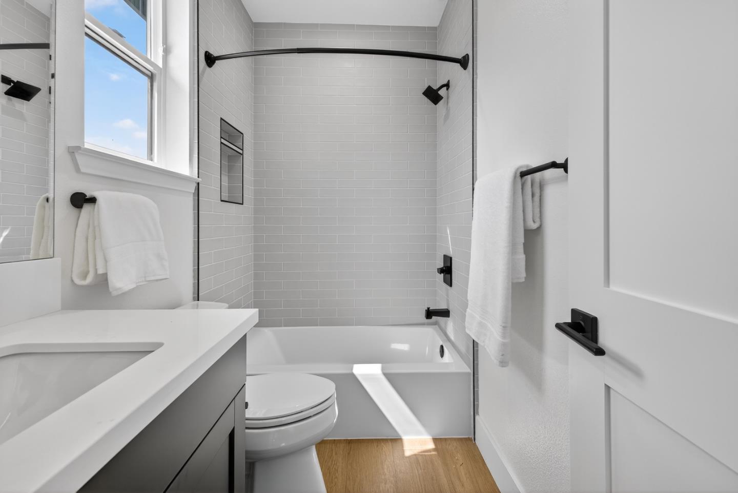 955 Woodside Road Redwood City, CA 94061 - Photo 42 of 46 a bathroom with a sink toilet and shower