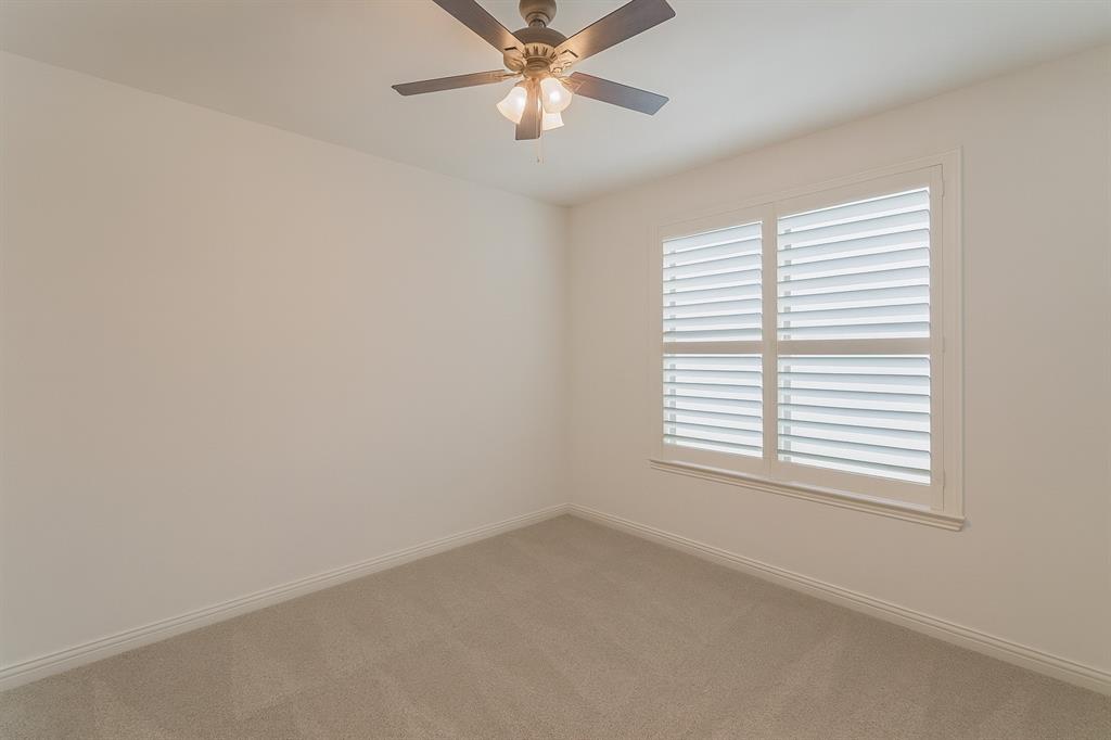 1908 Grey Bark Street Fort Worth, TX 76008 - Photo 19 of 31 Unfurnished room with carpet and ceiling fan