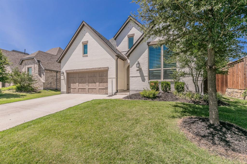 1908 Grey Bark Street Fort Worth, TX 76008 - Photo 2 of 31 View of front facade with brick siding, driveway, and a garage