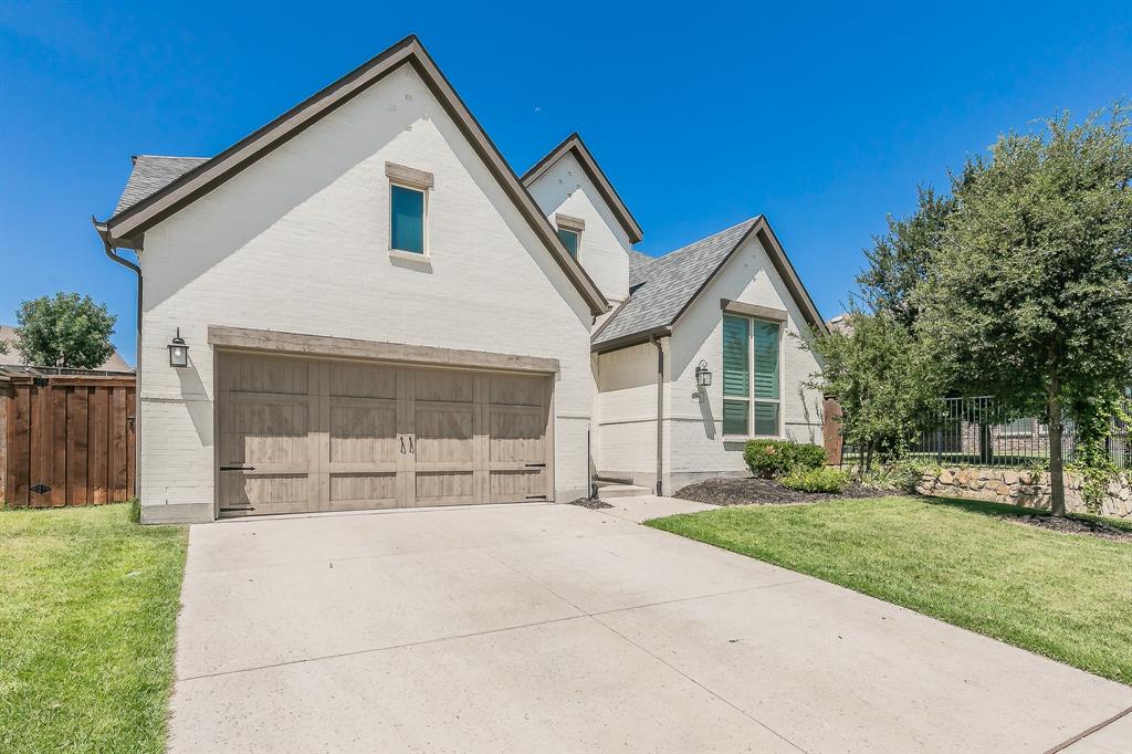 1908 Grey Bark Street Fort Worth, TX 76008 - Photo 23 of 31 View of front of home featuring a garage, driveway, and brick siding