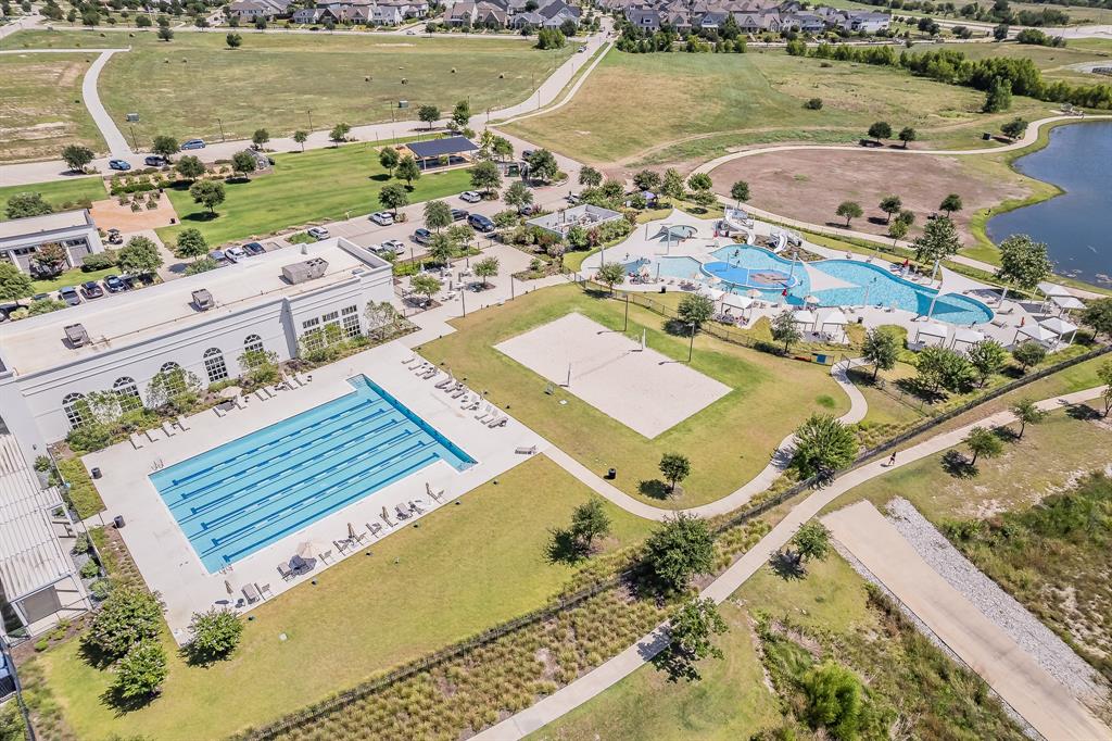 1908 Grey Bark Street Fort Worth, TX 76008 - Photo 26 of 31 Drone / aerial view of a pool area and a nearby body of water