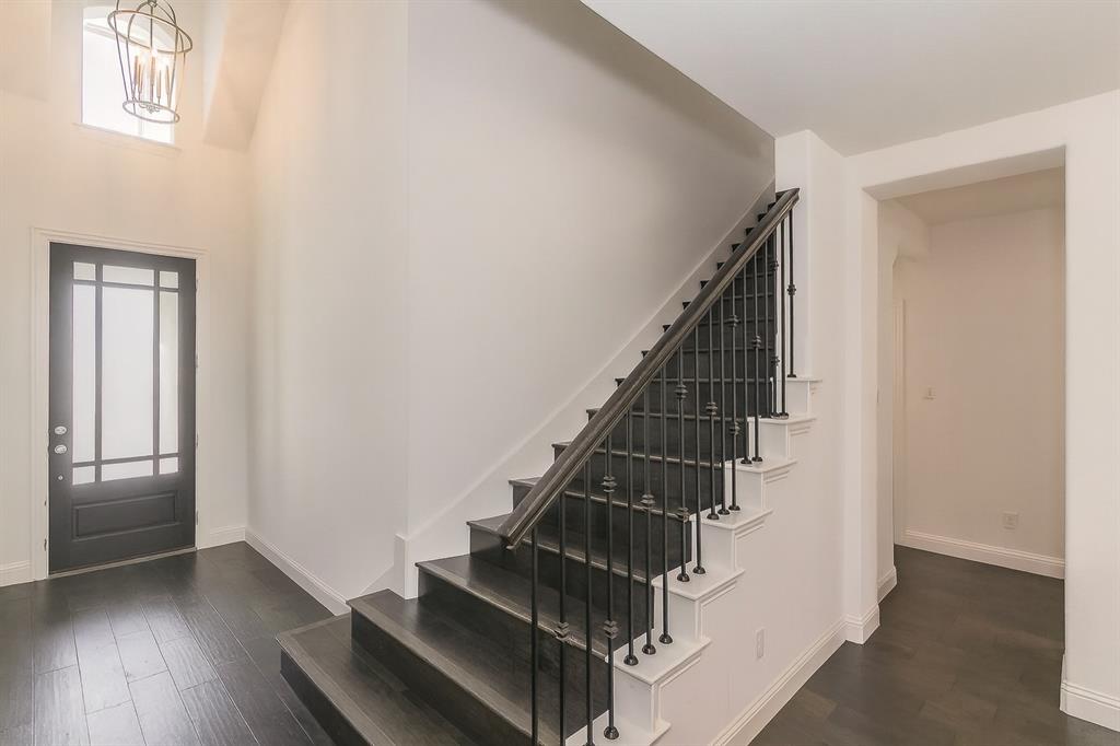 1908 Grey Bark Street Fort Worth, TX 76008 - Photo 10 of 31 Entryway featuring dark wood-style flooring and stairway