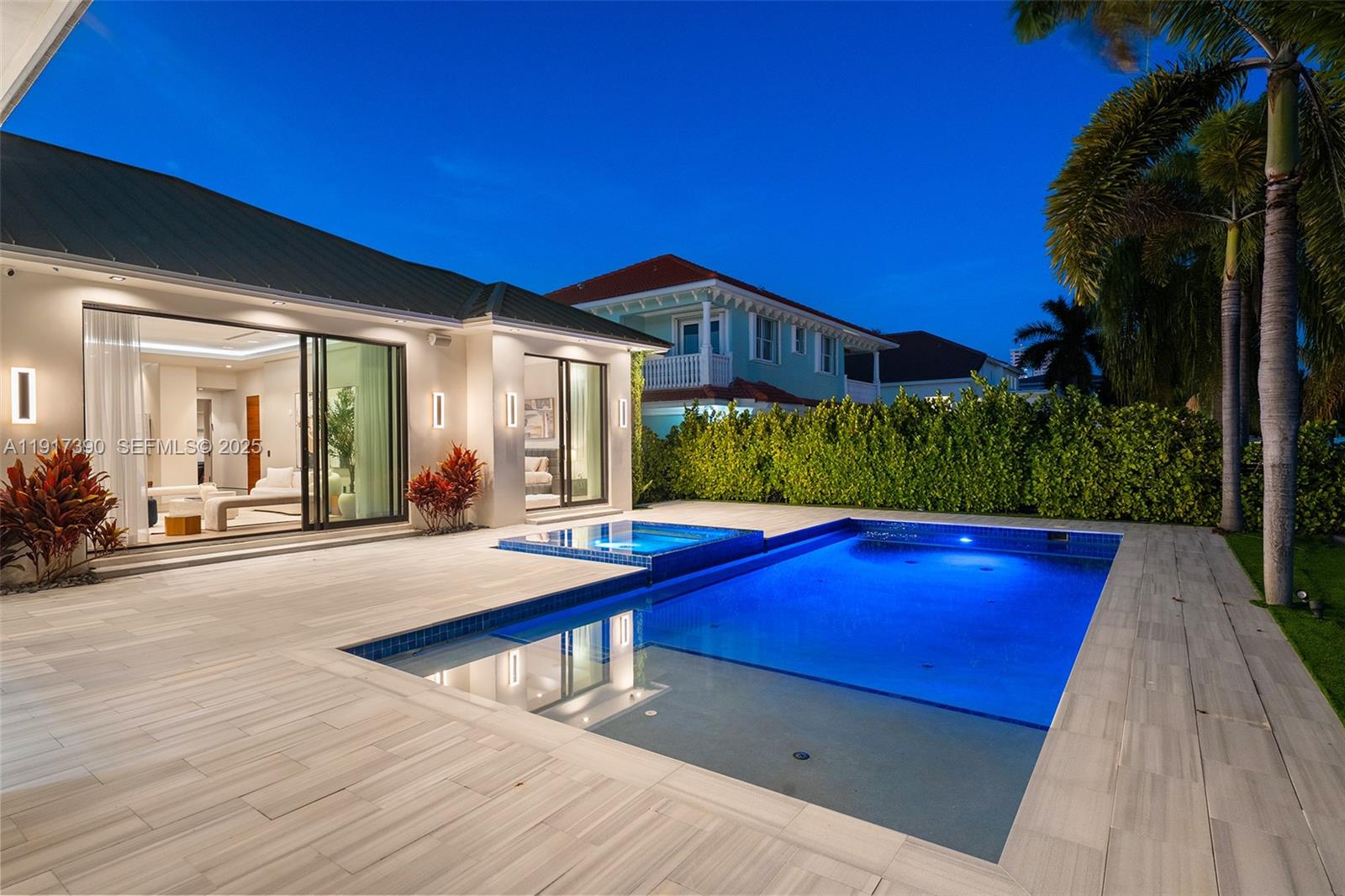 900 Washington Street Hollywood, FL 33019 - Photo 52 of 61 a view of swimming pool with outdoor seating and plants