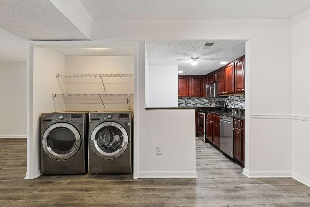 6900 Roswell Road, Unit Q6 Atlanta, GA 30328 - Photo 11 of 38 a kitchen with a washer and dryer