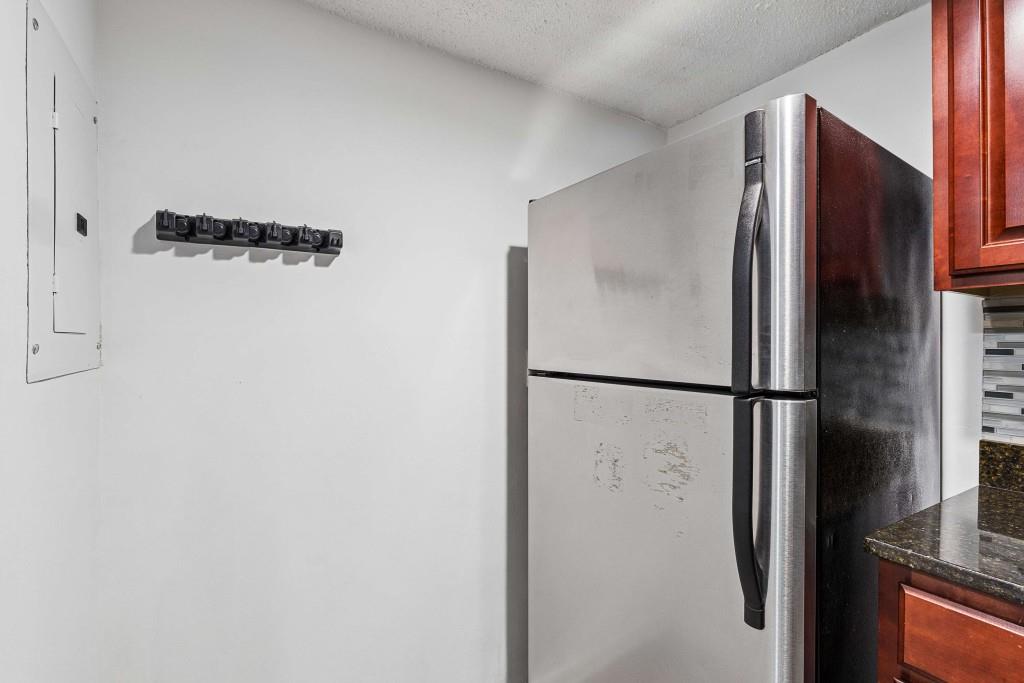 6900 Roswell Road, Unit Q6 Atlanta, GA 30328 - Photo 15 of 38 a bathroom with a refrigerator and a refrigerator