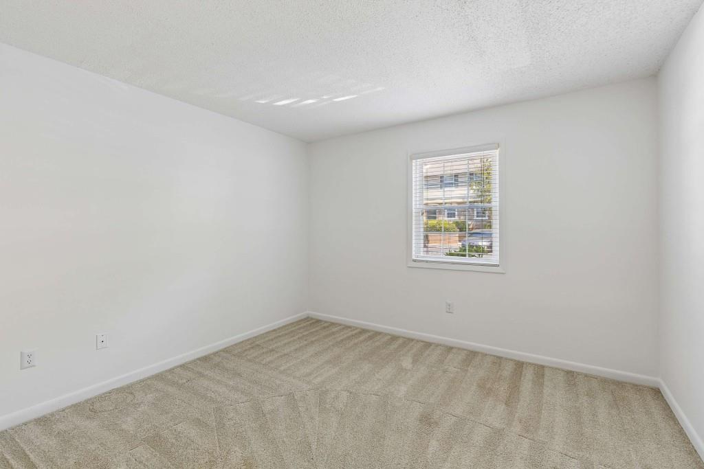 6900 Roswell Road, Unit Q6 Atlanta, GA 30328 - Photo 21 of 38 an empty room with a window