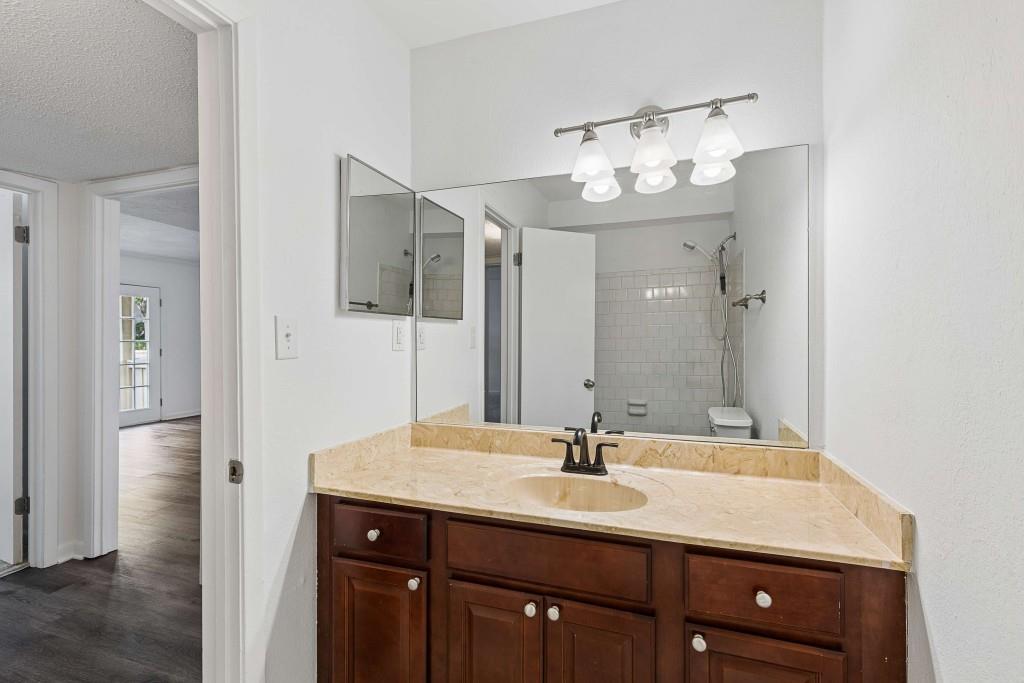 6900 Roswell Road, Unit Q6 Atlanta, GA 30328 - Photo 24 of 38 a bathroom with a sink and a mirror