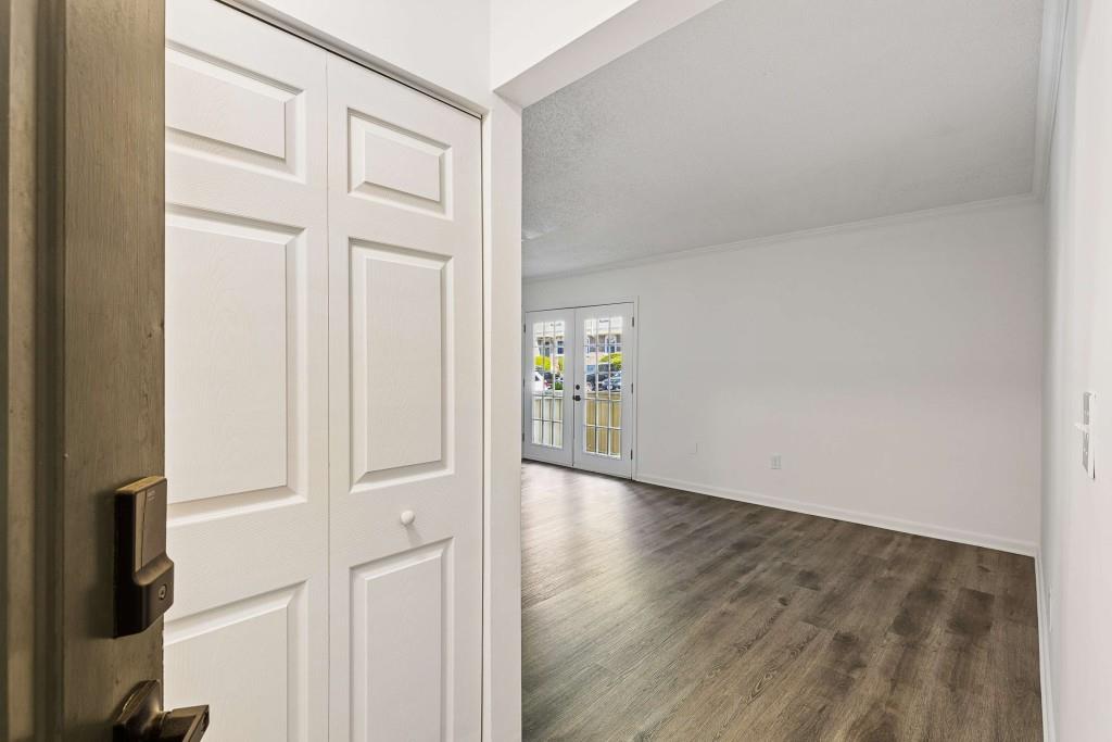 6900 Roswell Road, Unit Q6 Atlanta, GA 30328 - Photo 6 of 38 an empty room with wooden floor and windows
