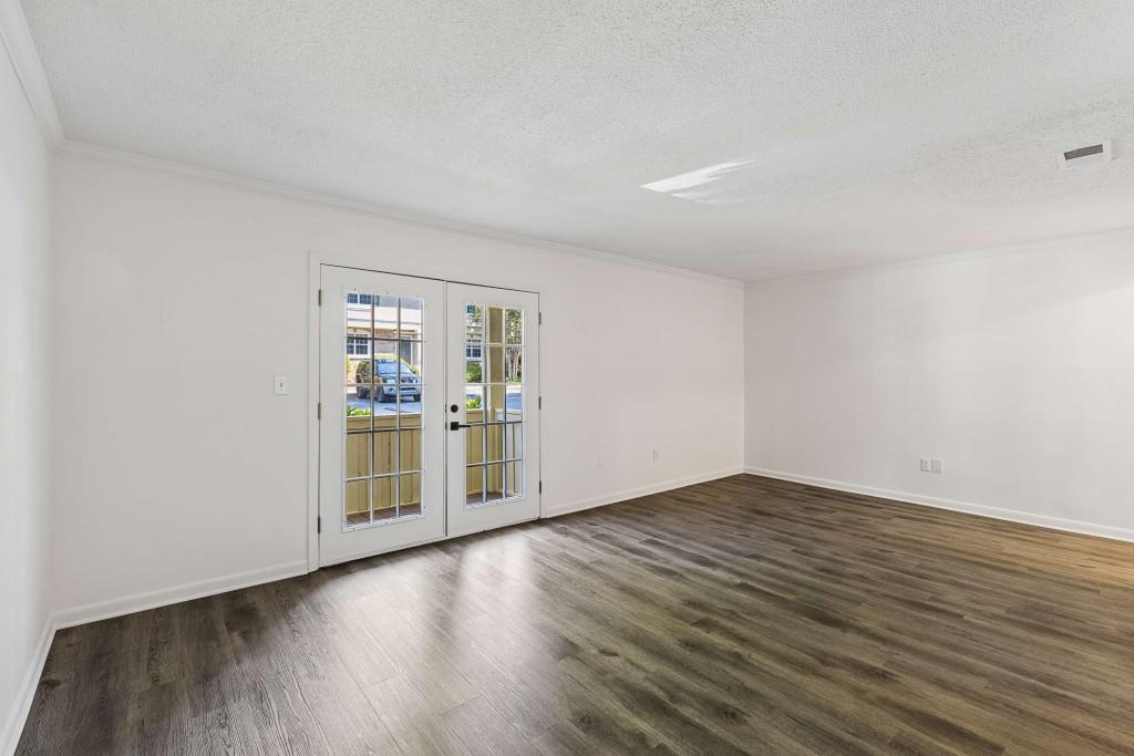 6900 Roswell Road, Unit Q6 Atlanta, GA 30328 - Photo 8 of 38 a view of a room with wooden floor