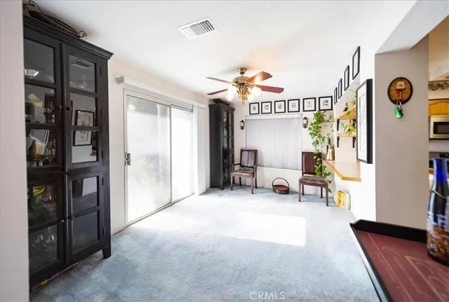 a view of a livingroom with furniture and window