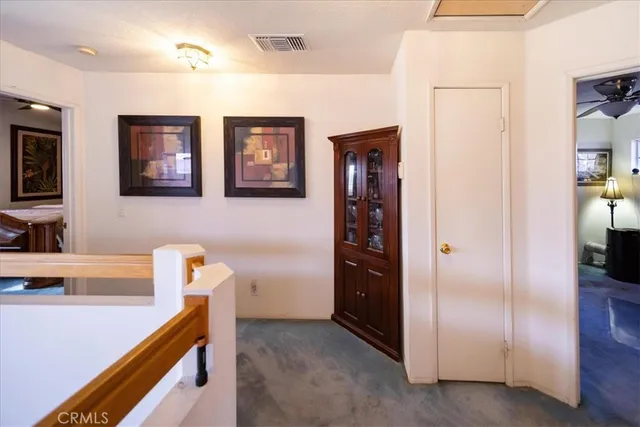 a bathroom with a sink vanity mirror and toilet