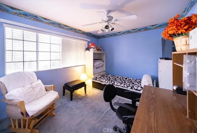 a living room with furniture and a chair