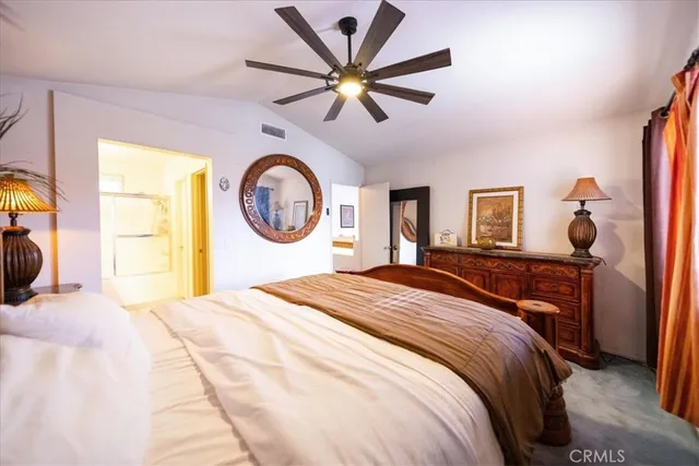 a view of walk in closet with clothes
