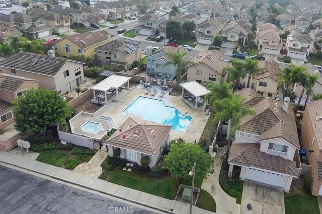 an aerial view of residential house with outdoor space and parking