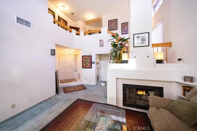 a living room with furniture and a fireplace