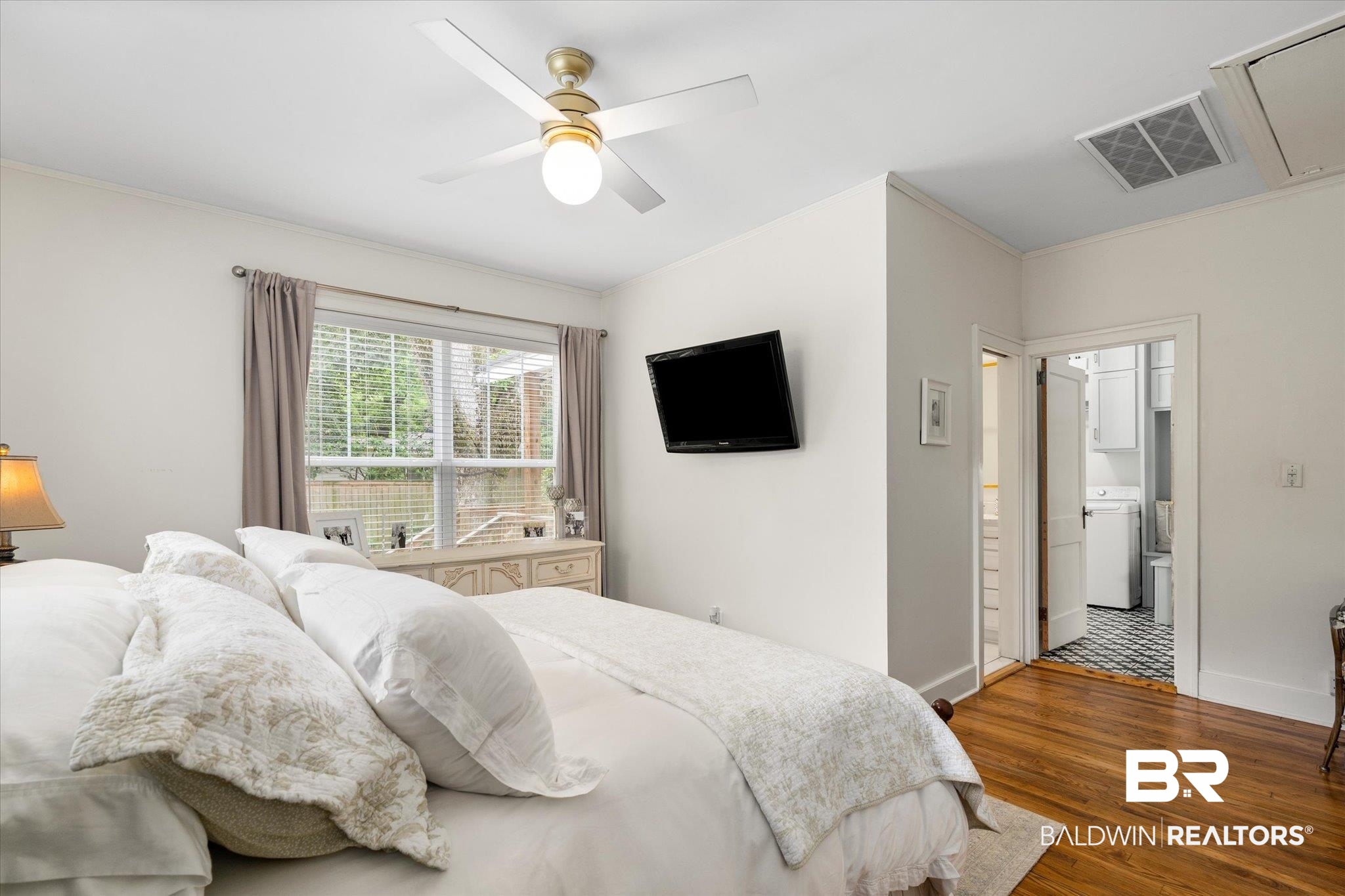 112 Crenshaw Street Mobile, AL 36606 - Photo 12 of 21 Bedroom with wood finished floors, baseboards, ornamental molding, and visible vents