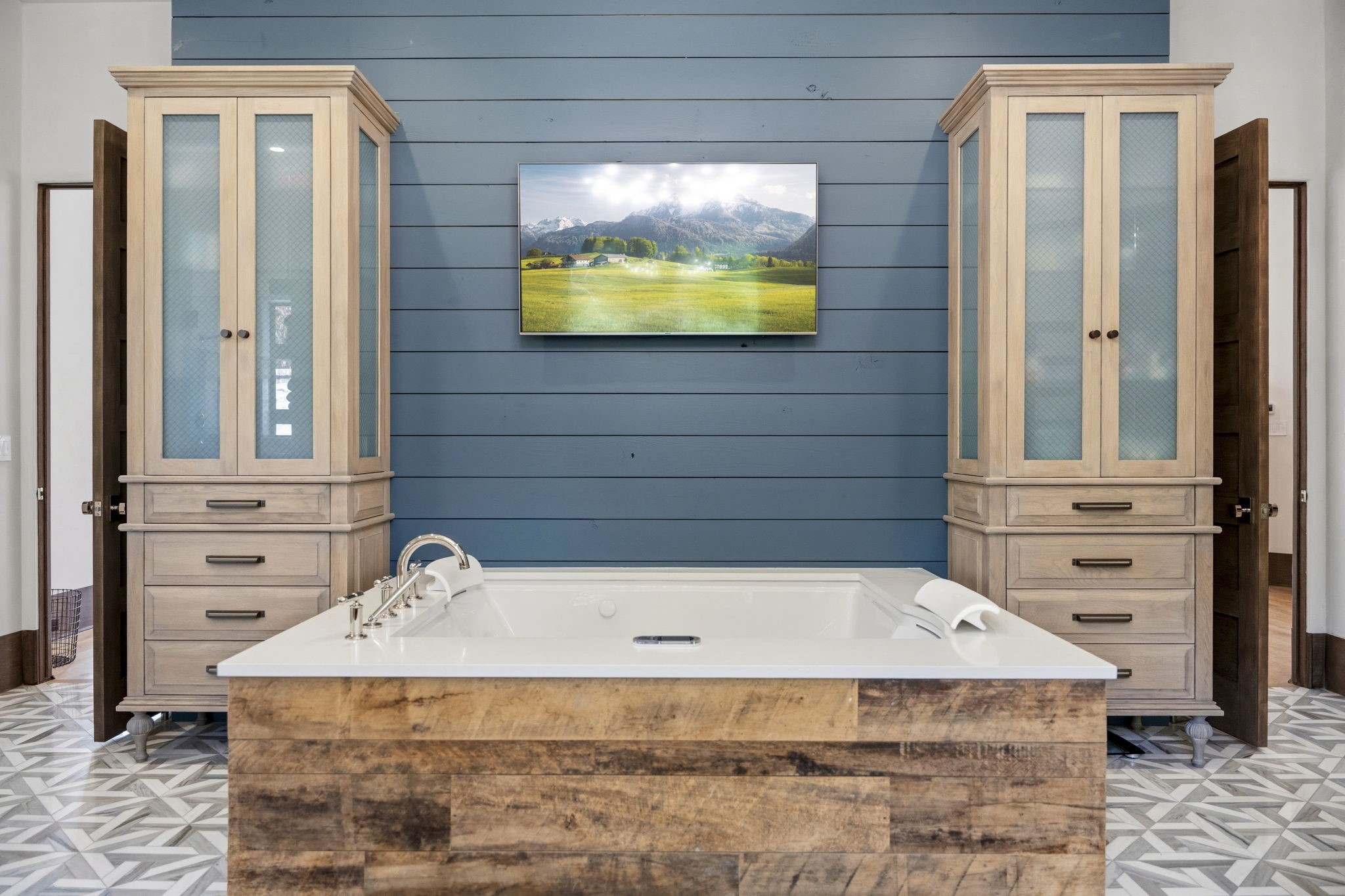 27006 Star Gazer Way Spring, TX 77386 - Photo 29 of 50 Exceptional details include a lighted fog-free shower mirror, dual custom medicine cabinets, dedicated makeup vanity, integrated TV, and refined finishes throughout this luxurious retreat.