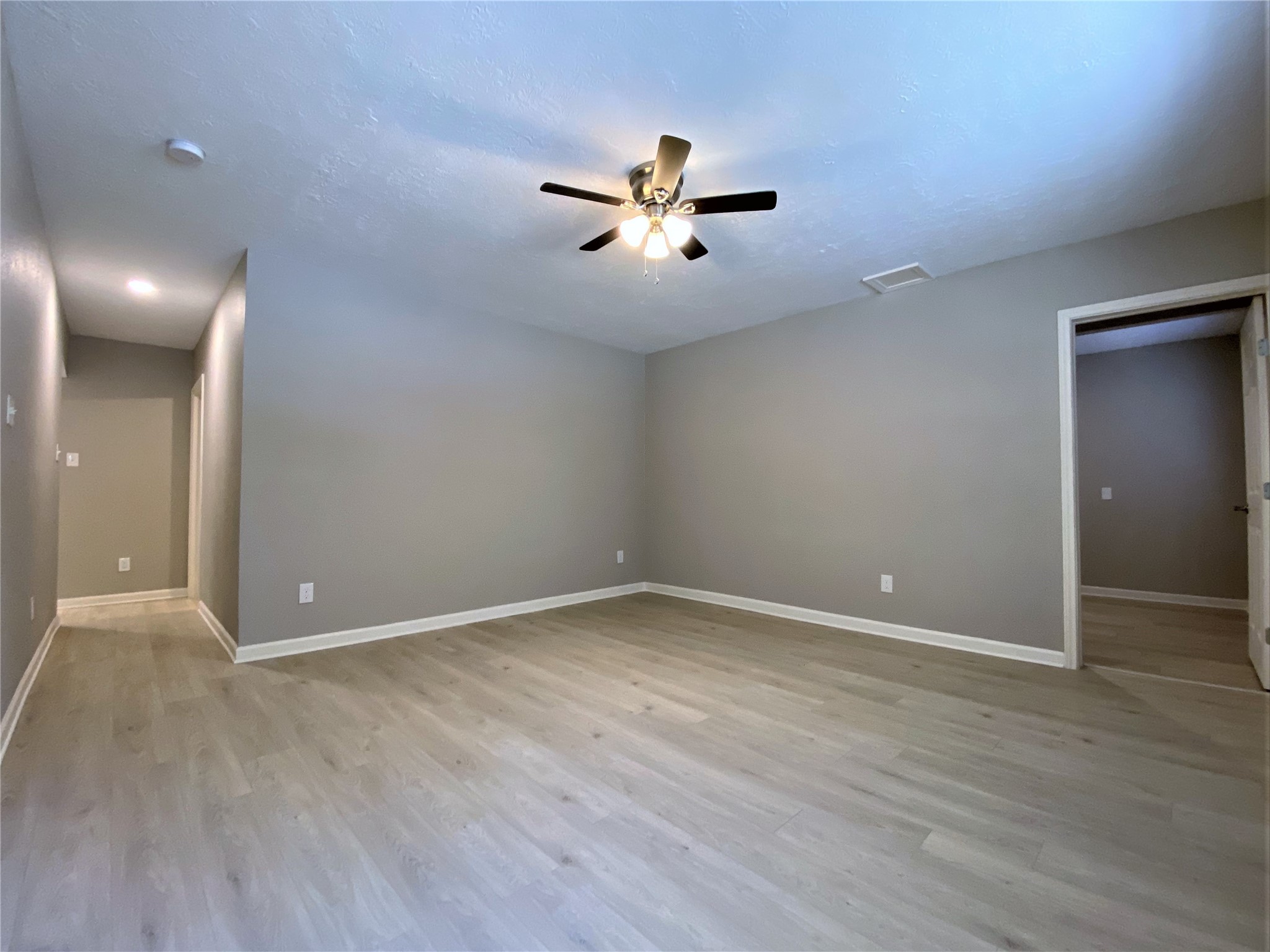 1702 Studewood Street Houston, TX 77009 - Photo 8 of 11 The living room offers a ceiling fan with light fixture.