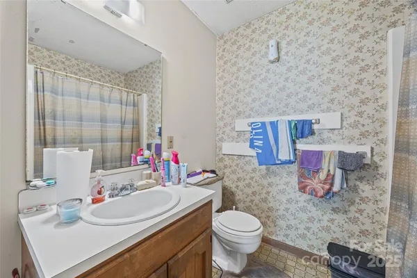 a view of a roof deck with wooden floor and fence