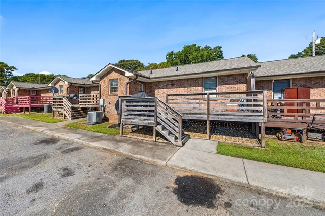 a view of multiple houses with a road