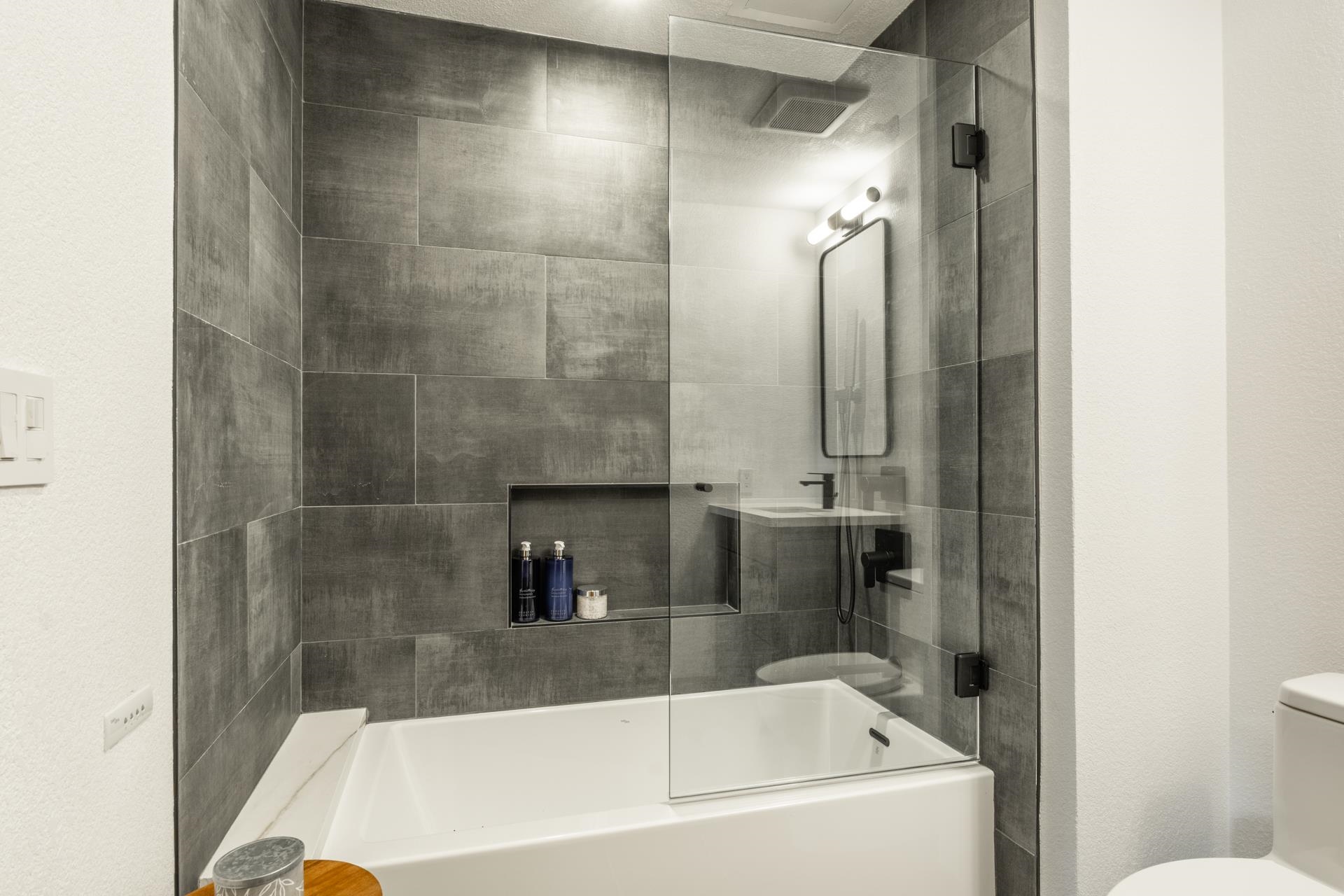6201 Minaret Road, Unit 2430 Mammoth Lakes, CA 93546 - Photo 35 of 54 Bright bedroom featuring a large window with mountain scenery, wood-finish flooring, a ceiling fan w
