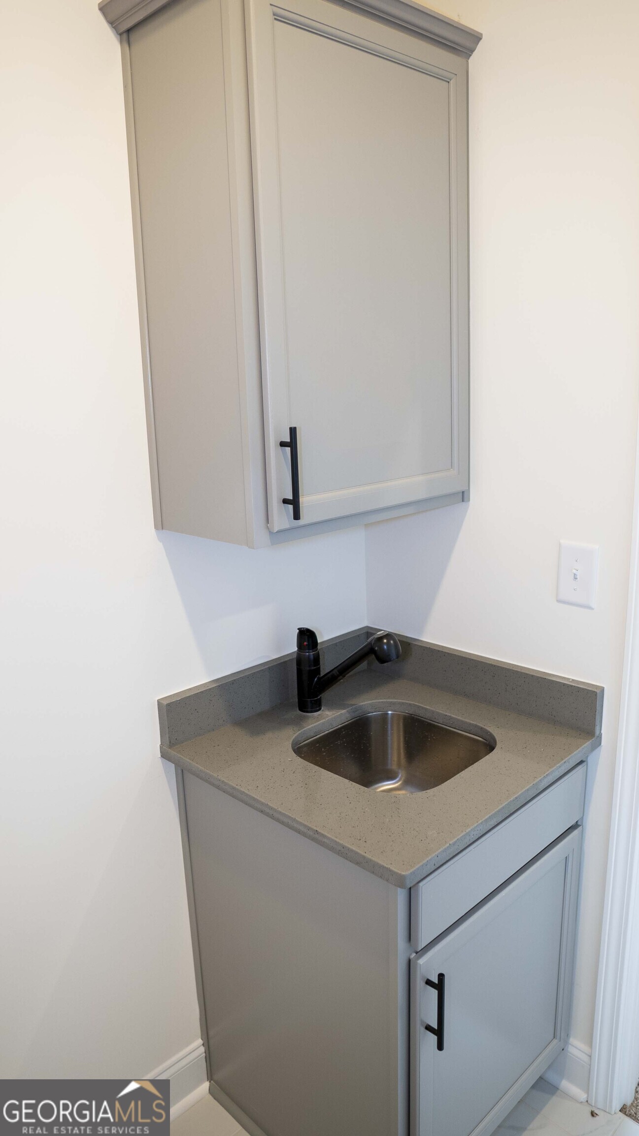 604 Beaver Court Perry, GA 31069 - Photo 36 of 40 a kitchen with a sink and cabinets