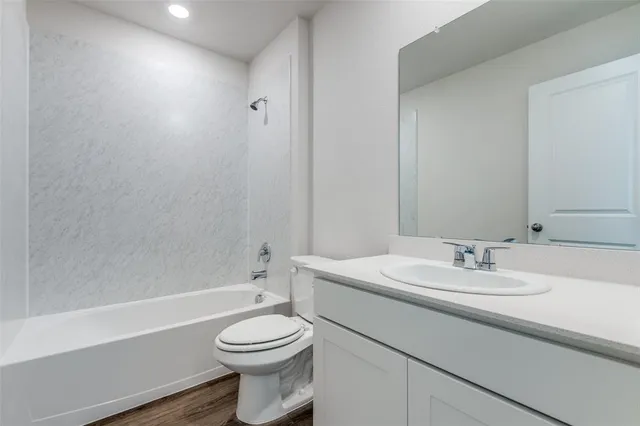 a bathroom with a sink a toilet and a bathtub