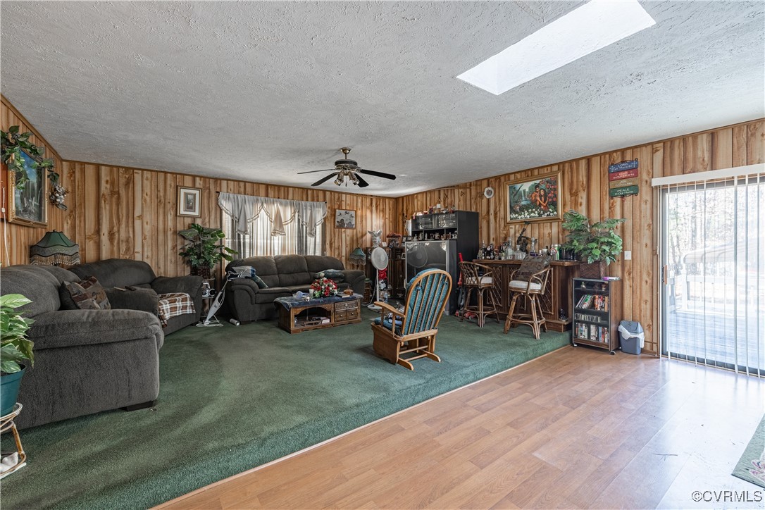 1107 Free State Road Meherrin, VA 23954 - Photo 29 of 45 Living room featuring a skylight, a textured ceili