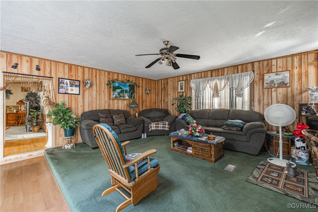 1107 Free State Road Meherrin, VA 23954 - Photo 30 of 45 Living room with ceiling fan, a textured ceiling,