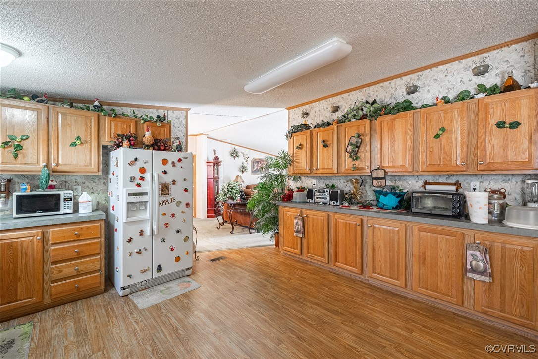 1107 Free State Road Meherrin, VA 23954 - Photo 35 of 45 Kitchen with a textured ceiling, ornamental moldin