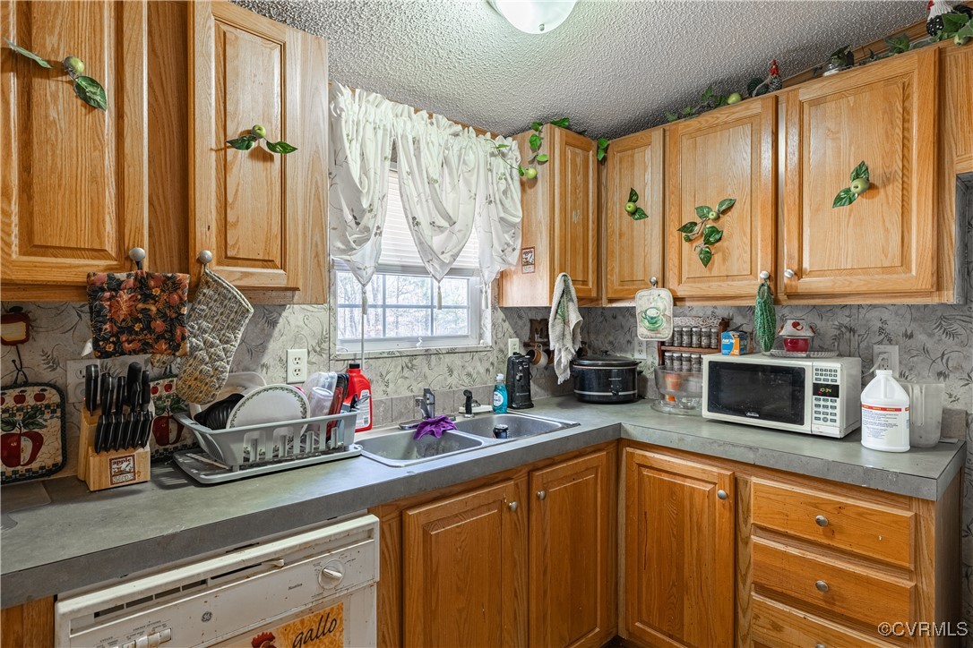 1107 Free State Road Meherrin, VA 23954 - Photo 36 of 45 Kitchen with a textured ceiling, white appliances,