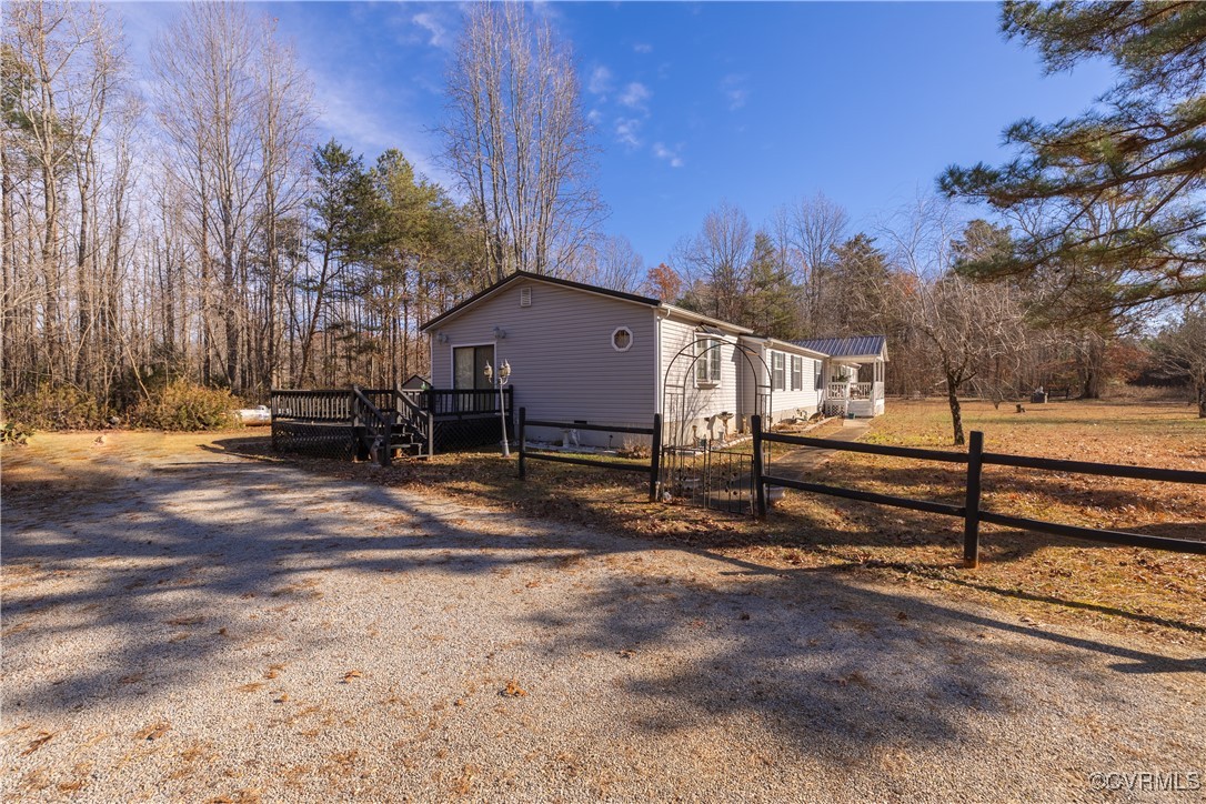 1107 Free State Road Meherrin, VA 23954 - Photo 4 of 45 View of side of home with a wooden deck