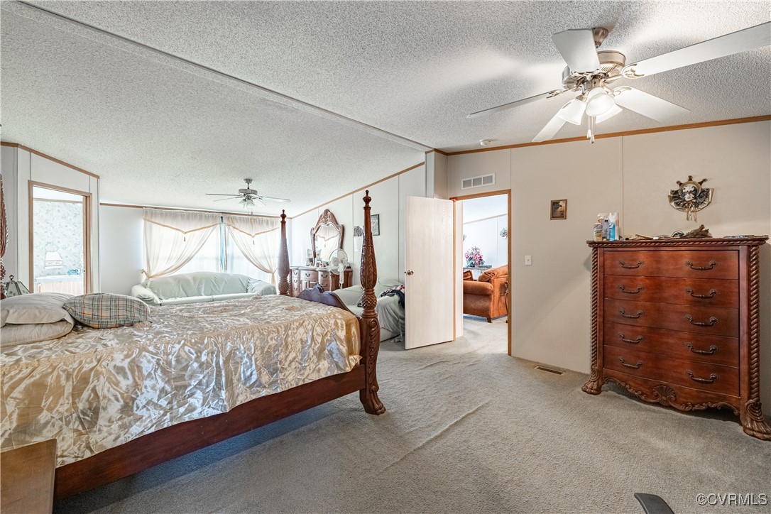 1107 Free State Road Meherrin, VA 23954 - Photo 41 of 45 Carpeted bedroom with ceiling fan, ornamental mold