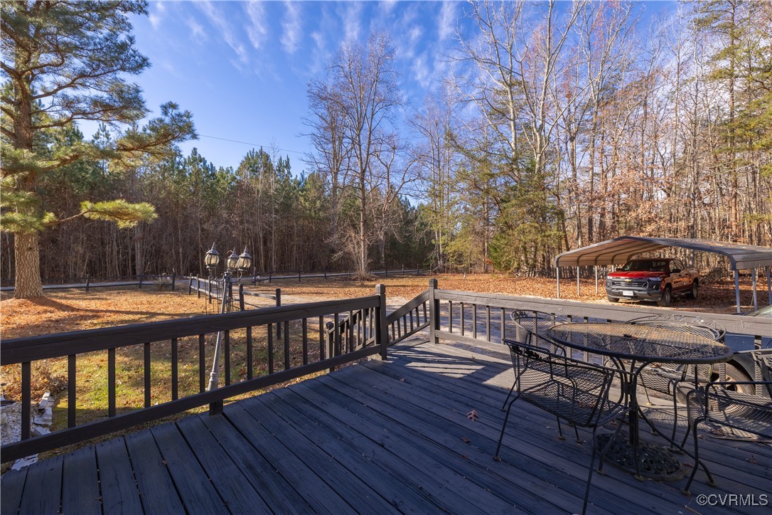 1107 Free State Road Meherrin, VA 23954 - Photo 6 of 45 Wooden deck with a carport