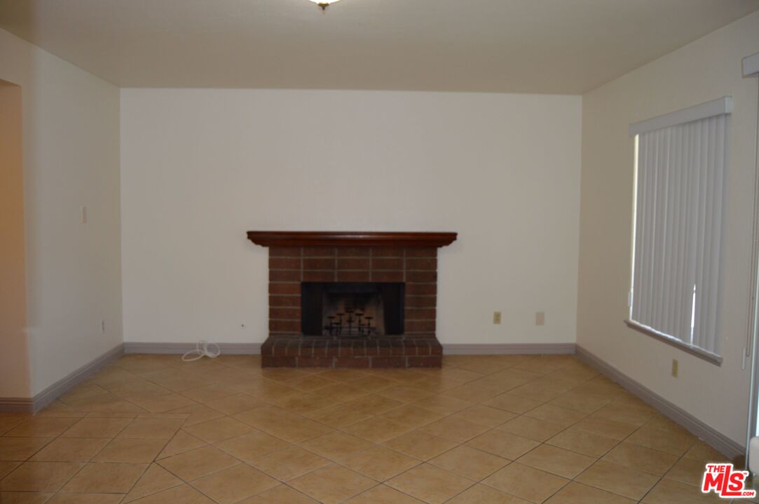 9315 Darren Circle Riverside, CA 92509 - Photo 8 of 41 an empty room with a fireplace