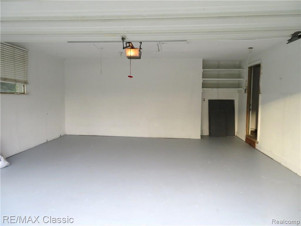 1967 East Commerce Road Commerce Township, MI 48382 - Photo 31 of 33 Finished garage with storage areas, one not shown.