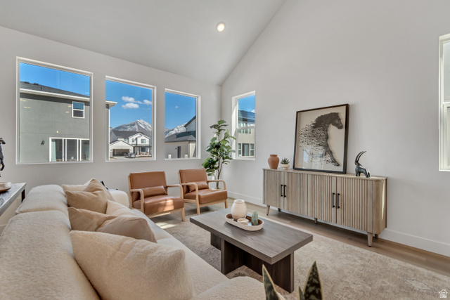 1302 1475 East, Unit 40 Payson, UT 84651 - Photo 13 of 34 Living room featuring wood finished floors, vaulted ceiling, and recessed lighting