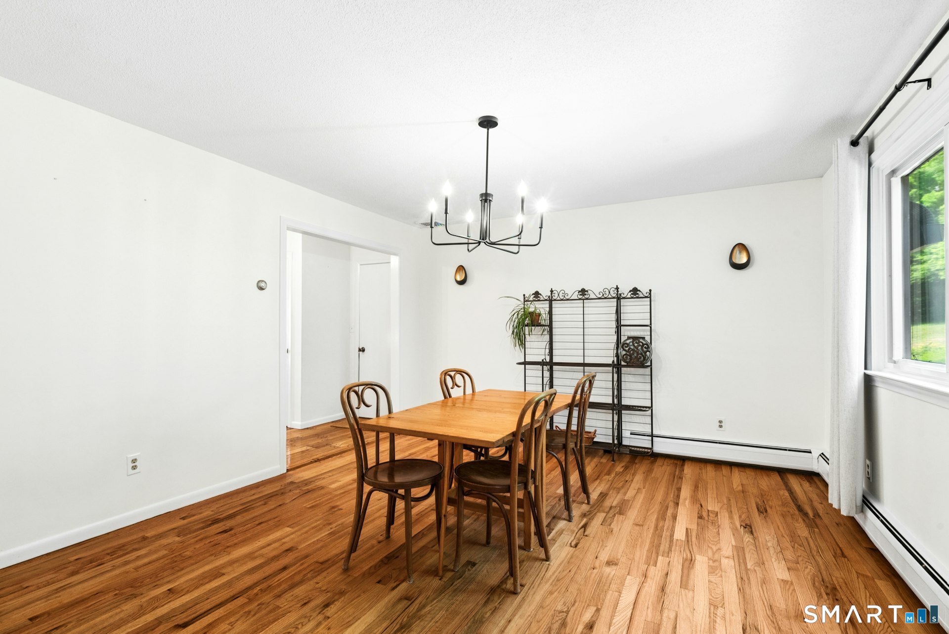 127 Huntingtown Road Newtown, CT 06470 - Photo 10 of 38 a view of a dining room with furniture window and wooden floor