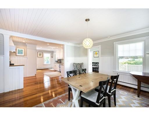 99 Hatherly Road Scituate, MA 02066 - Photo 11 of 31 a view of a dining room with furniture and wooden floor