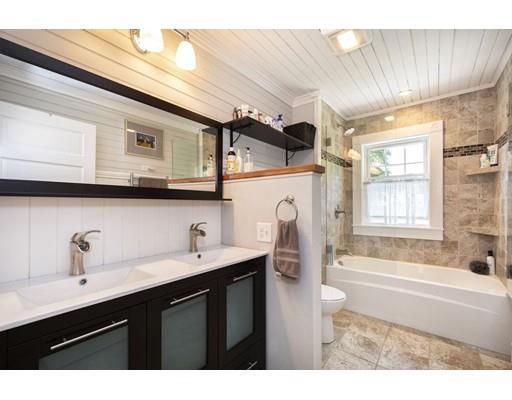 99 Hatherly Road Scituate, MA 02066 - Photo 22 of 31 a bathroom with a sink a mirror and a bathtub