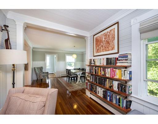 99 Hatherly Road Scituate, MA 02066 - Photo 9 of 31 a living room with lots of furniture and a book shelf