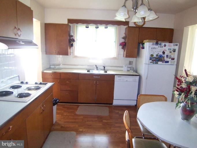 3825 Cherrybrook Road Randallstown, MD 21133 - Photo 4 of 11 Spacious Kitchen w/ Gleaming Wood Floors