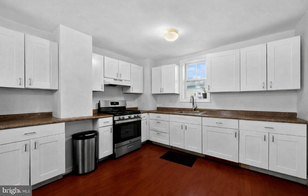 38 East Hancock Street Riverside, NJ 08075 - Photo 6 of 13 a kitchen with granite countertop white cabinets and stainless steel appliances