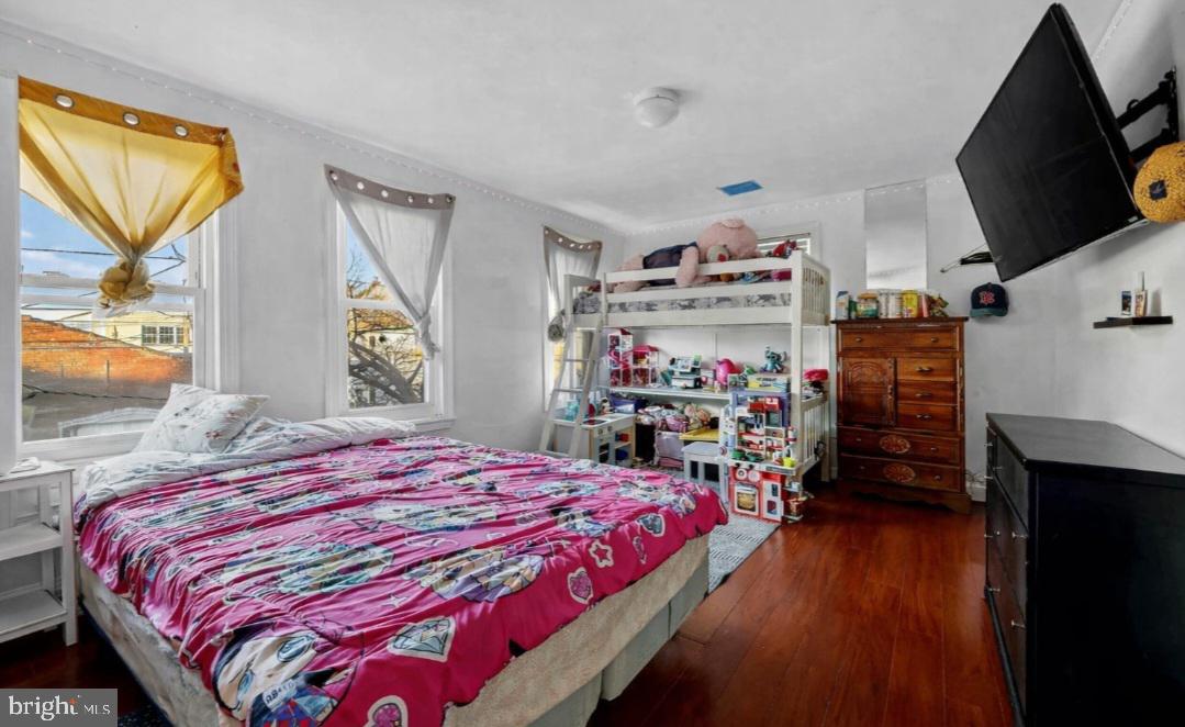 38 East Hancock Street Riverside, NJ 08075 - Photo 9 of 13 a bed sitting in a bedroom next to a window