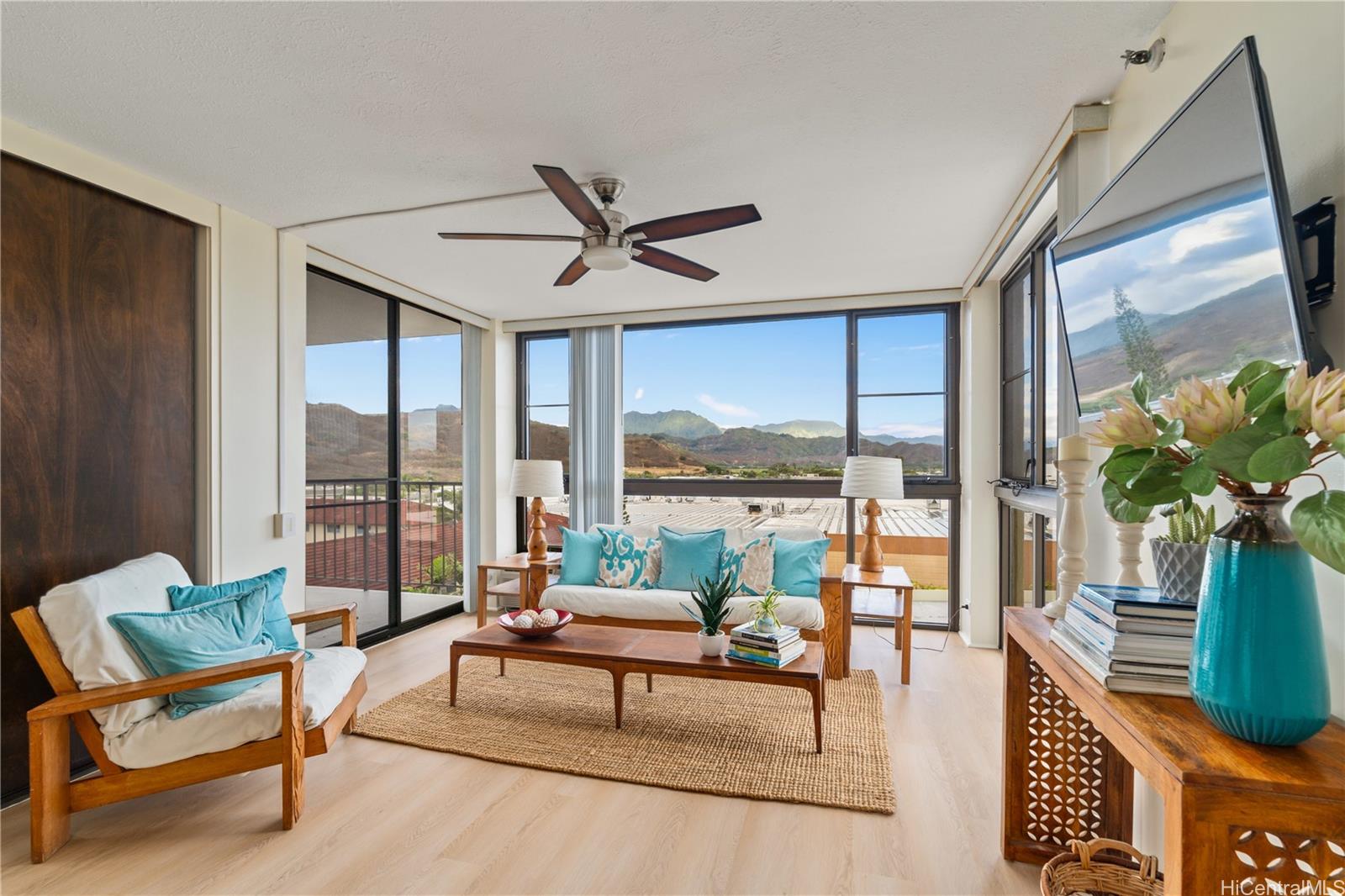 a living room with furniture and a large window