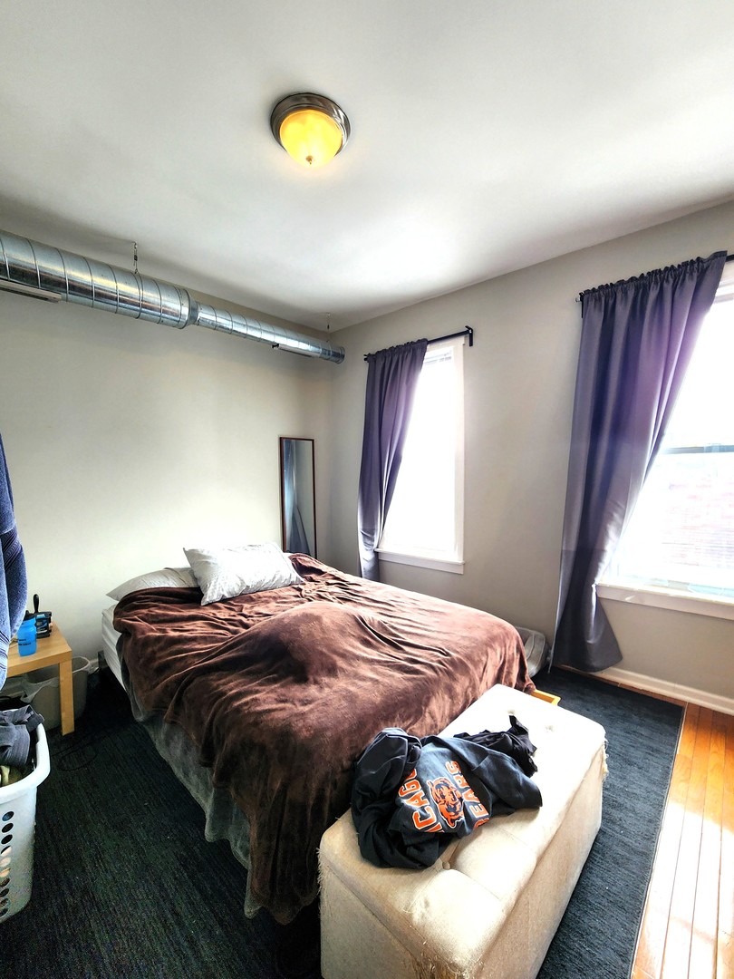 973 West 19th Street, Unit 3 Chicago, IL 60608 - Photo 5 of 10 a bedroom with a bed and window