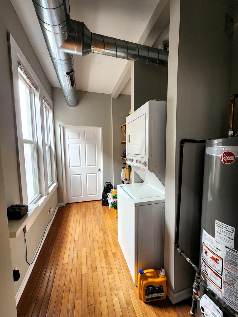 973 West 19th Street, Unit 3 Chicago, IL 60608 - Photo 10 of 10 a view of a kitchen with refrigerator and wooden floor