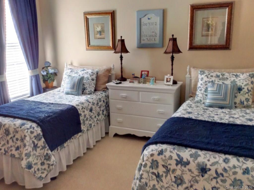 3233 Sapphire Lane Fort Mill, SC 29708 - Photo 15 of 24 a bedroom with bed and mirror